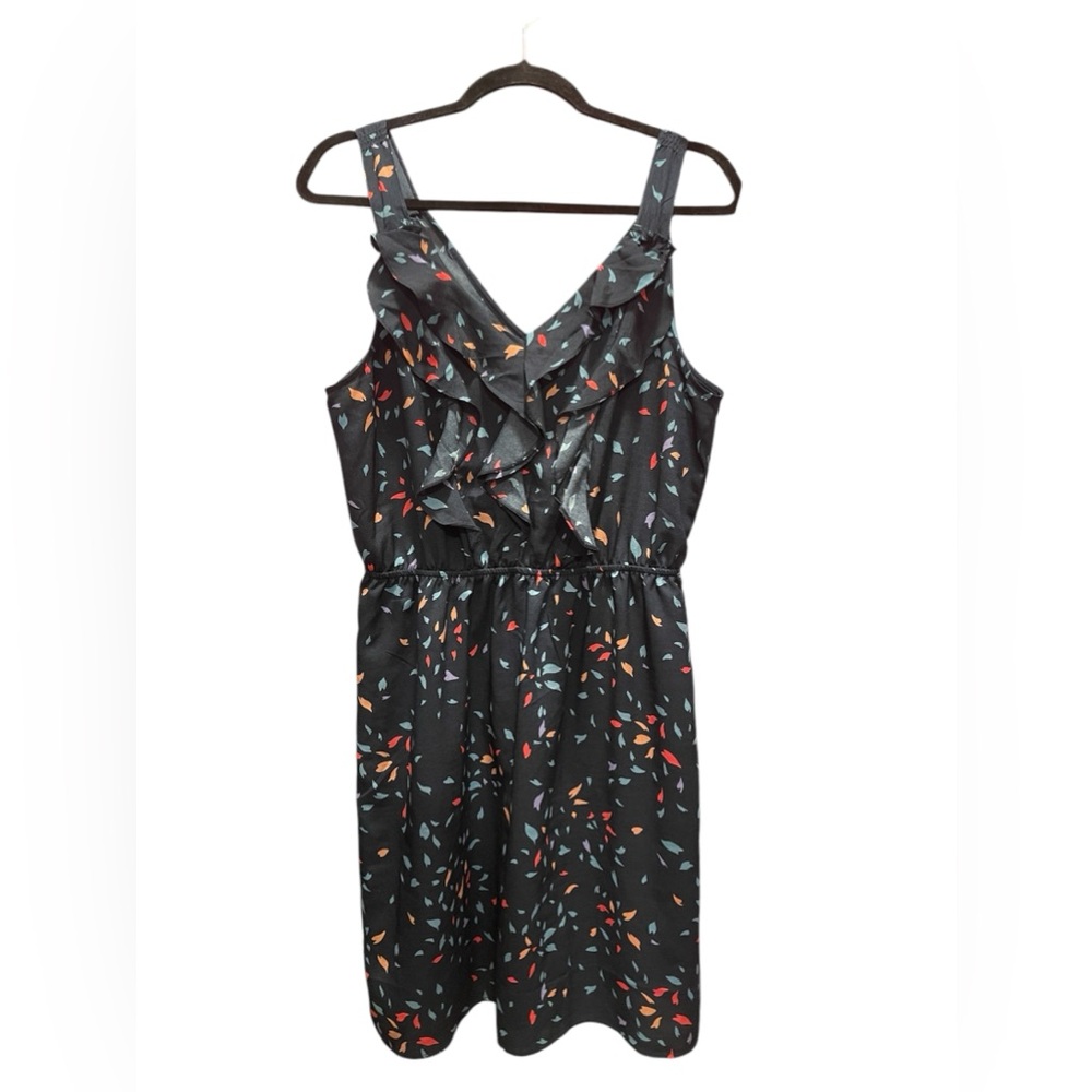 Navy, colorful, fun, sleeveless dress with ruffles.